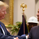 President Donald Trump shakes the hand of FCC Chair Ajit Pai at the White House on April 12, 2019